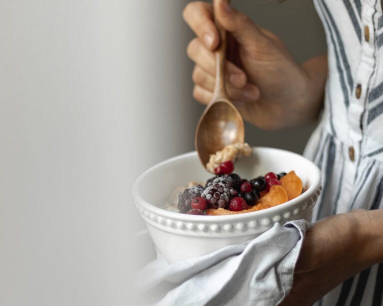 Close-up of a breakfast bowl with berries in a modern apartment