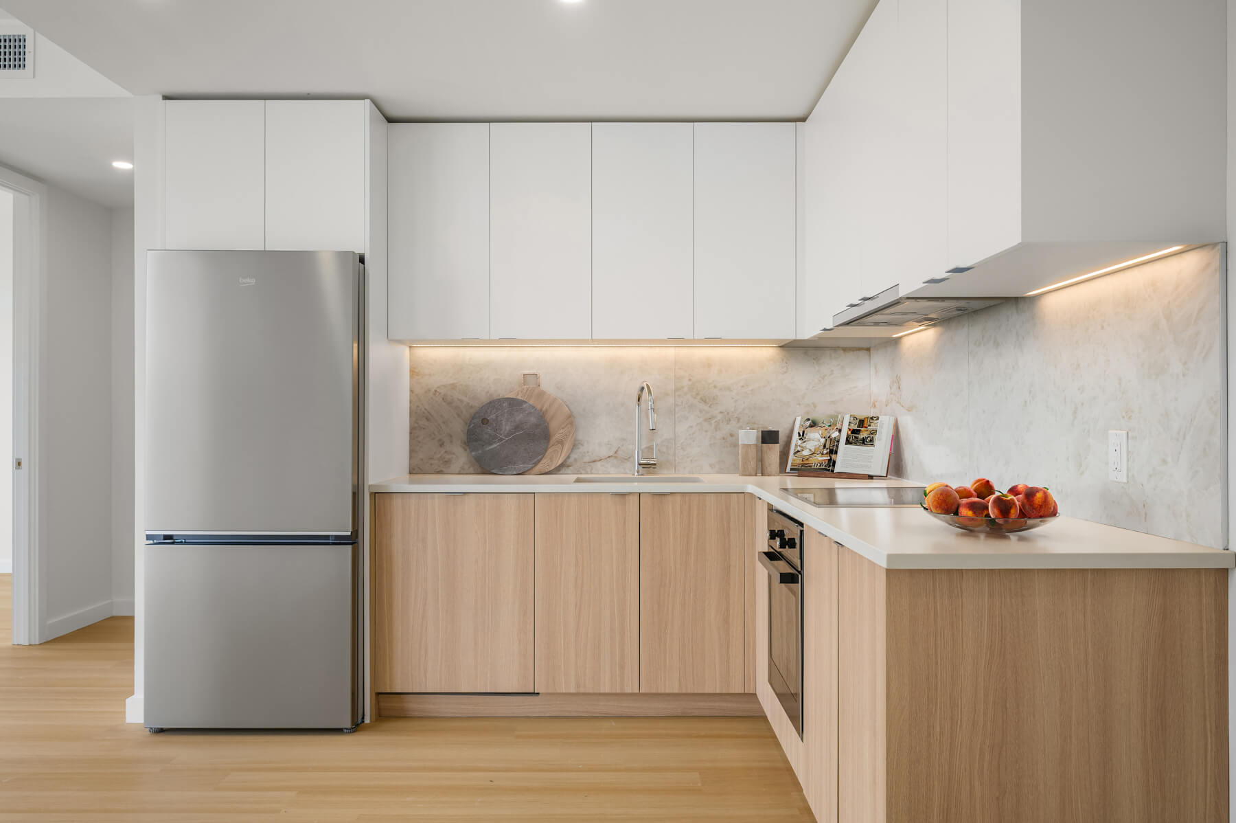 Modern kitchen with Caesarstone countertops in Prosper apartments